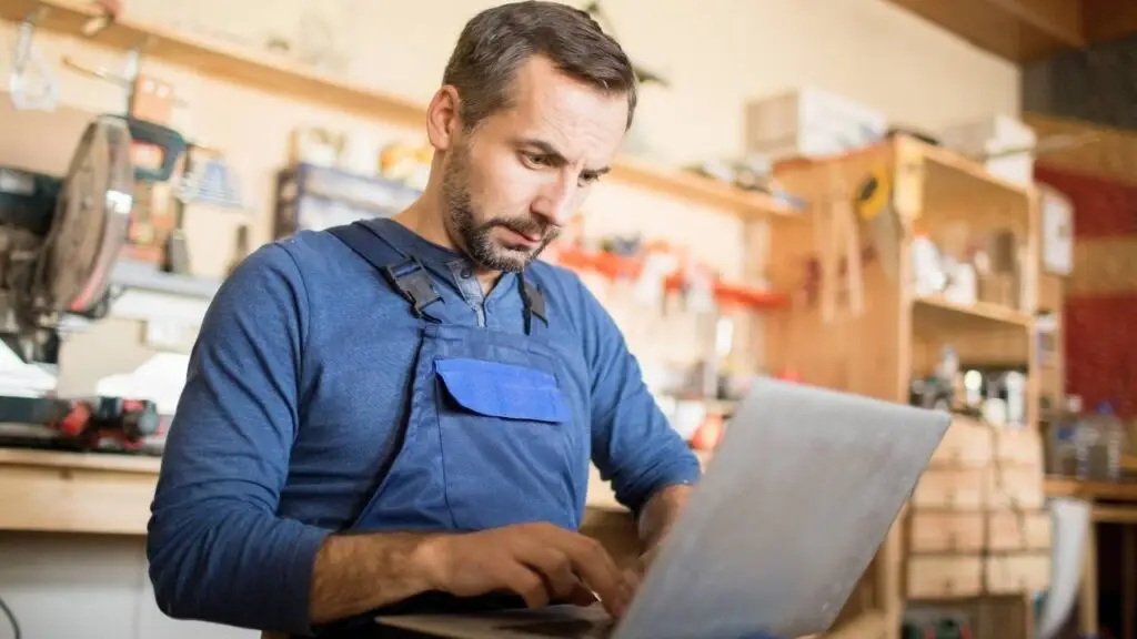 Small business owner evaluating WordPress vs Shopify website options.