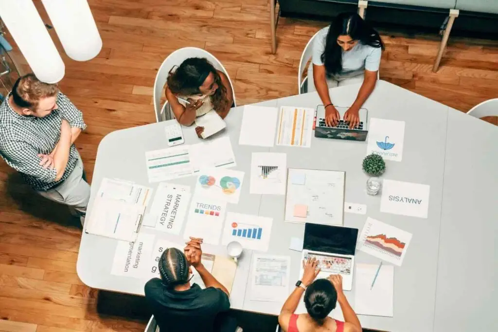 Marketing team reviewing data to compare SEO vs Google Ads Australia strategies.