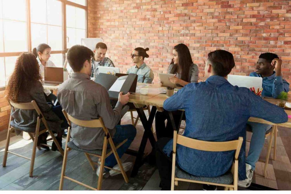 Small business team discussing strategy and data for market research small business in Australia.