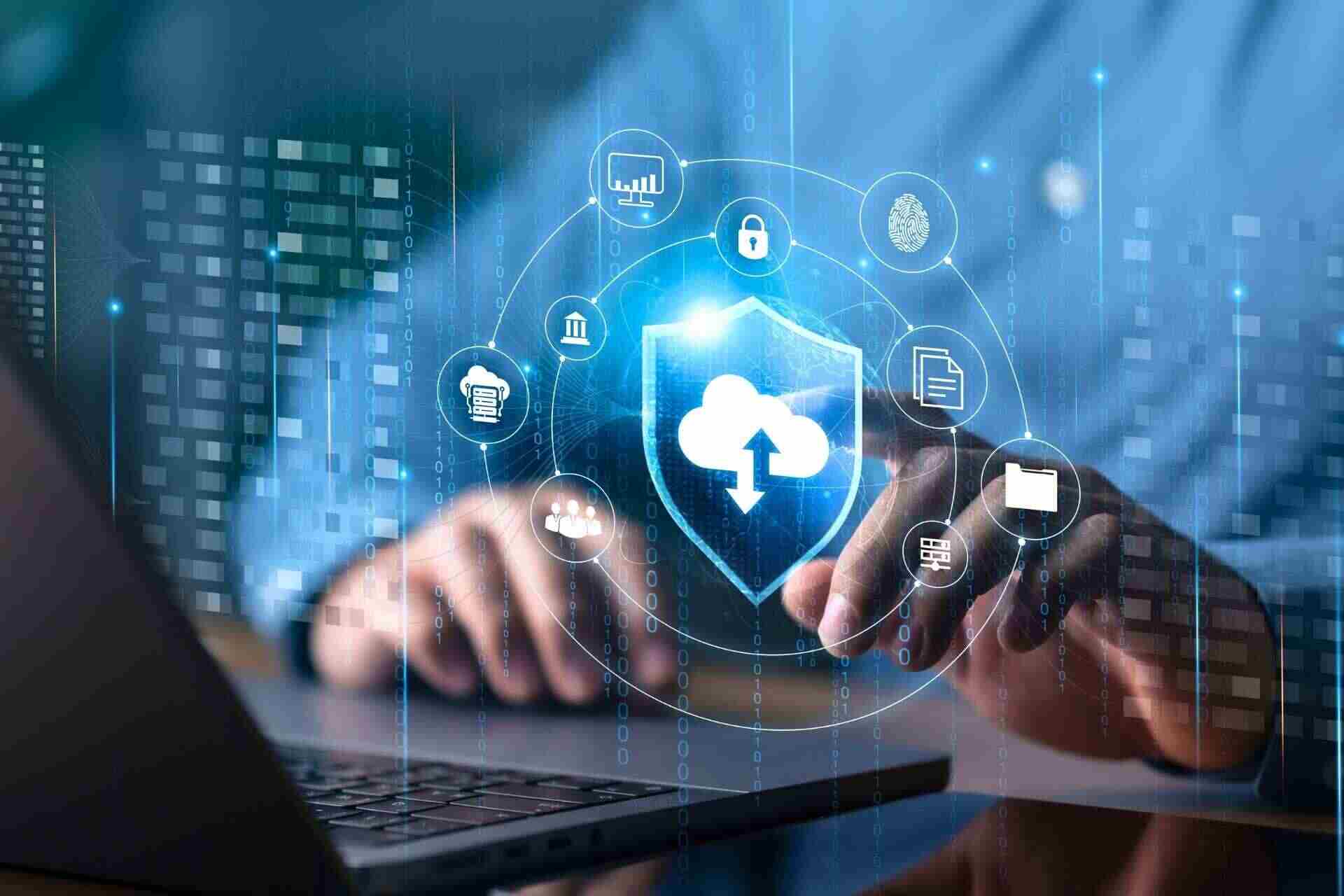 Hands working on a laptop with security graphics linked to a cybersecurity checklist for small business Australia.